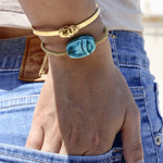 Bracelet tressé doré et scarabée