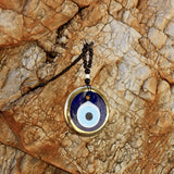 Oeil mural en verre soufflé bordure dorée