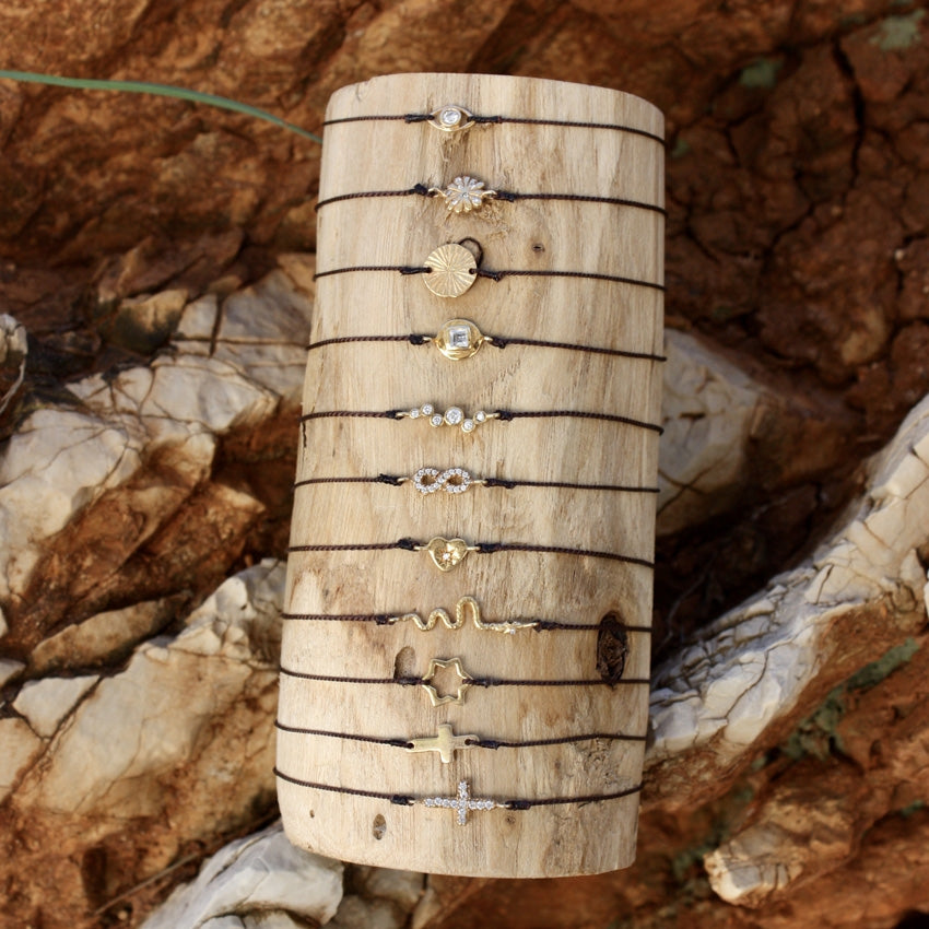 Bracelet tressé infini doré et zircons