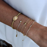 Bracelet tressé et zircons blancs