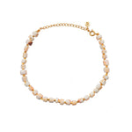Bracelet de cheville doré et coquillage blanc rosé