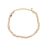 Bracelet de cheville doré et coquillage blanc rosé
