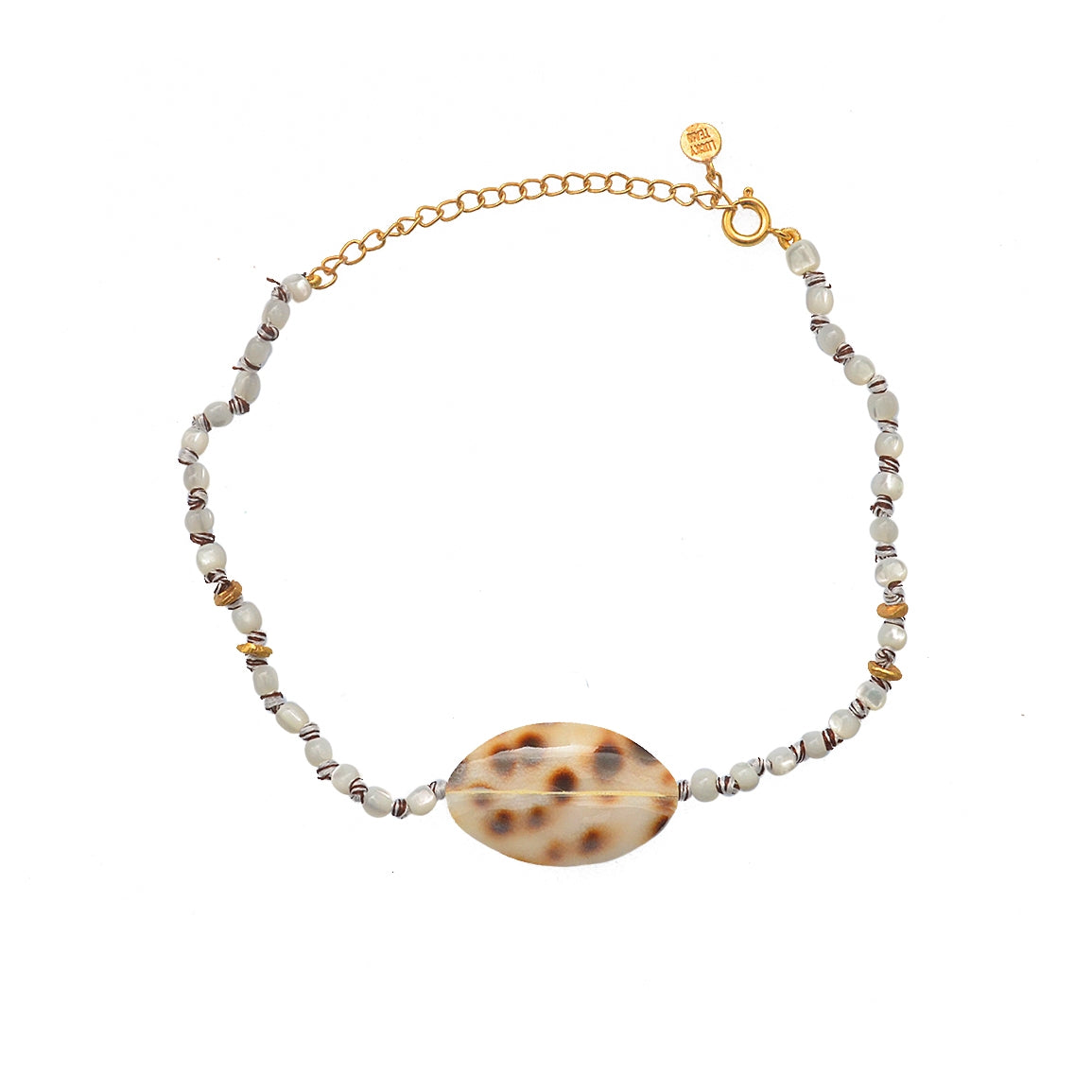 Bracelet de cheville doré et coquillages