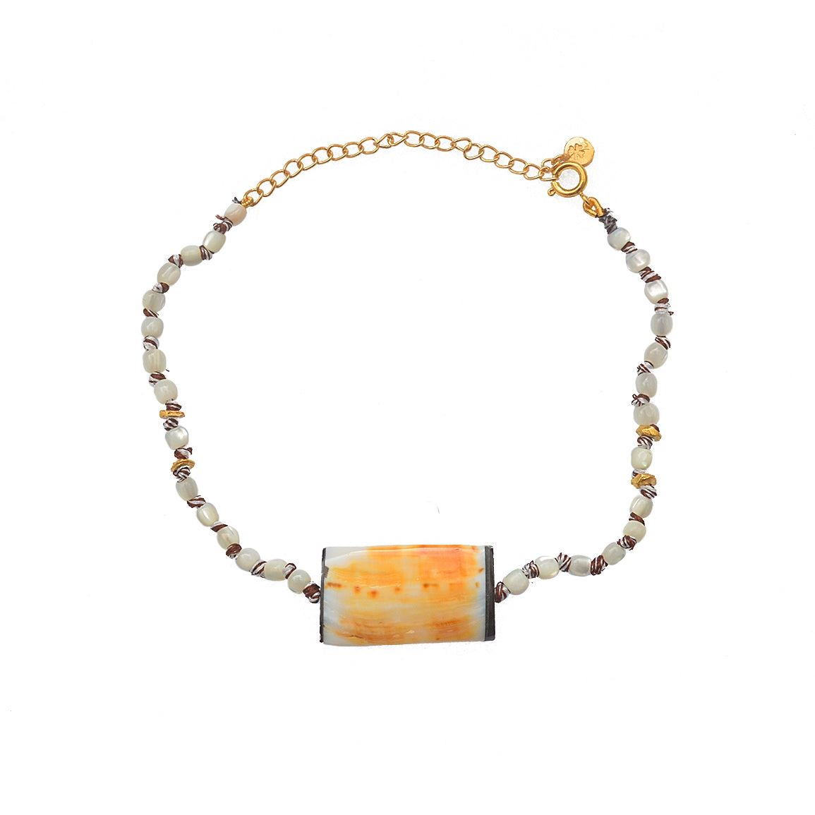 Bracelet de cheville doré et coquillages