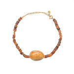 Bracelet de cheville doré et coquillage
