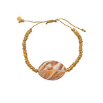 Bracelet cordon doré et coquillage
