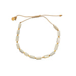 Bracelet cordon doré et coquillage