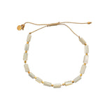 Bracelet cordon doré et coquillage