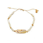 Bracelet cordon doré et coquillage