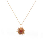 Collier doré pendentif soleil et pierre