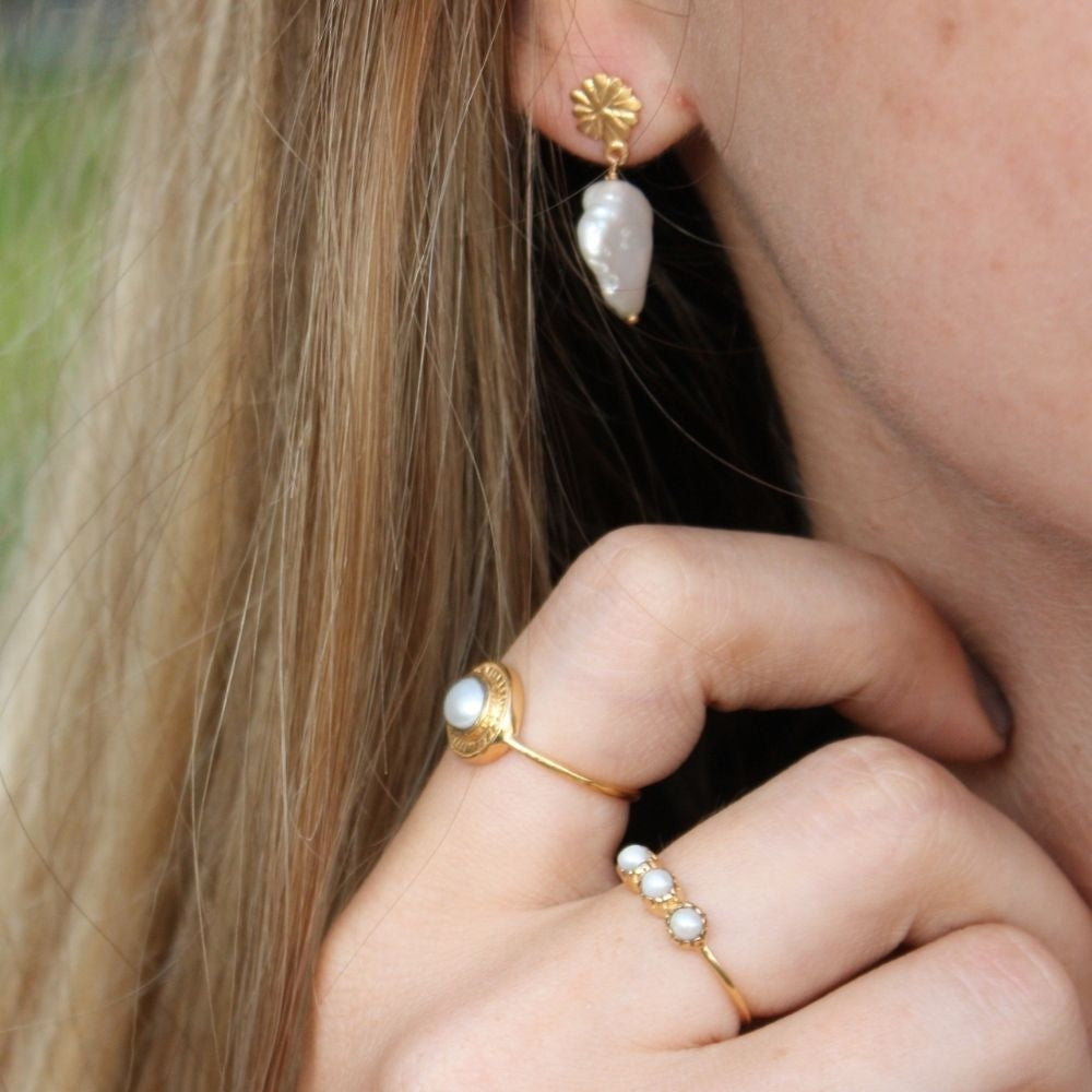 Bague dorée trilogie de pierres