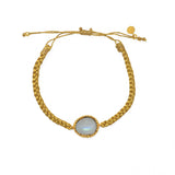 Bracelet cordon tressé doré et pierre cabochon