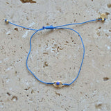 Bracelet cordon et oeil pierre