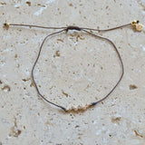 Bracelet tressé et zircons blancs