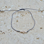 Bracelet tressé et croix argent 925