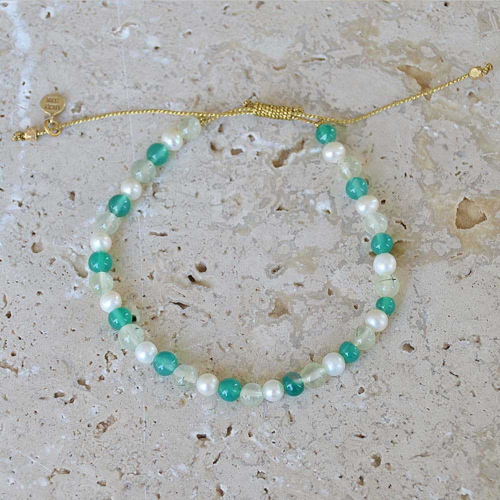 Bracelet tressé doré et perles