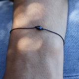 Bracelet noir et perle de culture grise