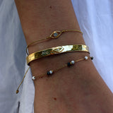 Bracelet cordon et oeil pierre