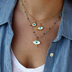 Collier doré poisson oeil en nacre