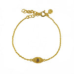 Bracelet doré et oeil martelé et pierre