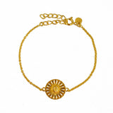 Bracelet doré médaille astres