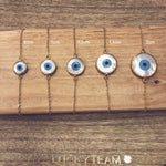 Bracelet doré et oeil nacre