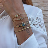 Bracelet doré sphère pierre et 4 zircons