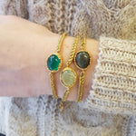 Bracelet cordon tressé doré et pierre cabochon