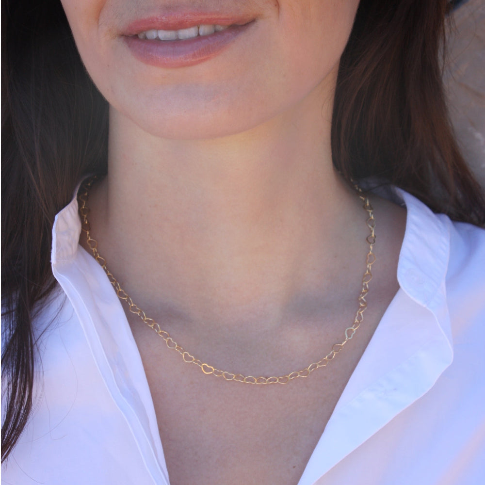 Collier doré maille coeurs entrelacés