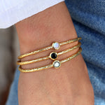 Jonc doré martelé et pierre ronde