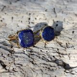 Bague dorée pierre ronde 4 griffes