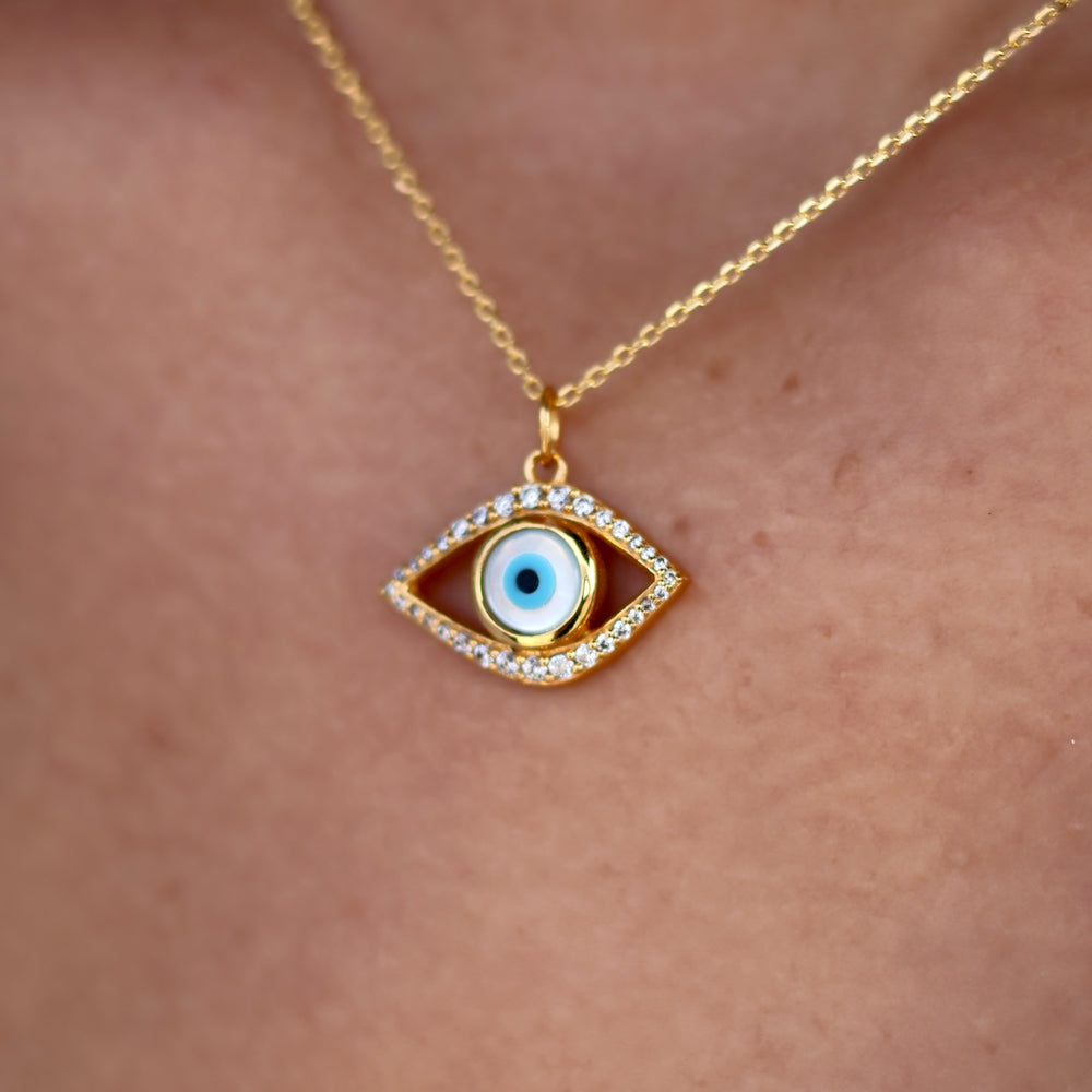 Collier doré oeil évidé nacre et zircons