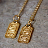 Collier doré plaque serpent et zircons