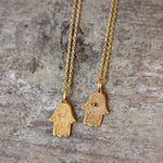 Collier main de fatma dorée et zircon