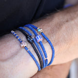 Bracelet vinyle bleu marine et perle chevron
