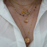 Gold necklace with medal engraved with leaves and "LUCKY YOU"