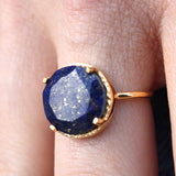 Bague dorée pierre ronde 4 griffes