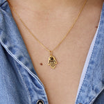 Collier doré main de fatma pierre et zircons