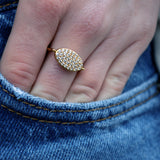 Oval gold ring with zircons