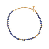 Bracelet de cheville doré et pierres rondes