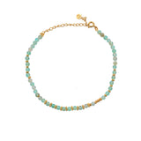 Bracelet de cheville doré et pierres facettées