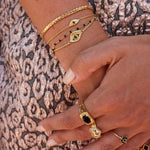 Chevalière dorée triple anneaux et pierre ovale