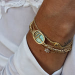 Bracelet doré scarabée pierre