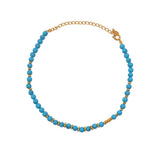 Bracelet de cheville doré et pierres rondes