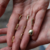 Mini gold hoop earrings with diamond-shaped zircons