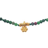 Gold bracelet with tassel and natural stones