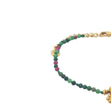 Gold bracelet with tassel and natural stones