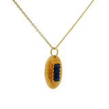 Gold necklace with textured oval pendant and stone