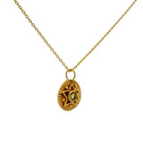 Gold necklace with star and stone medal