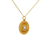 Gold necklace with lucky charm medal and stone